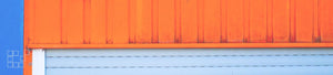 Orange vertical panels above a pale blue shutter, with a narrow blue wall at the left.