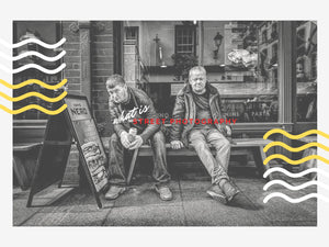 Candid black and white street photo capturing real-life emotion on a city sidewalk, ideal as expressive wall art