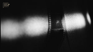 Film negatives and contact sheets on a light table, reflecting my return to film before choosing digital photography again.