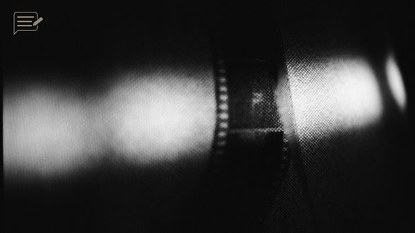 Film negatives and contact sheets on a light table, reflecting my return to film before choosing digital photography again.
