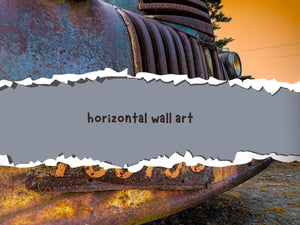 Horizontal wall art title over a close-up photograph of a weathered blue truck grille and rusty bumper.