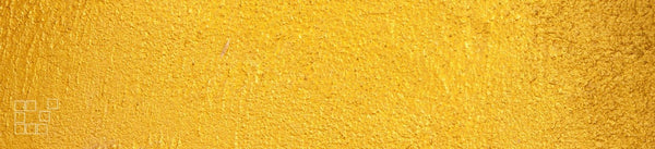Gold wall art banner with a richly textured surface in warm metallic gold