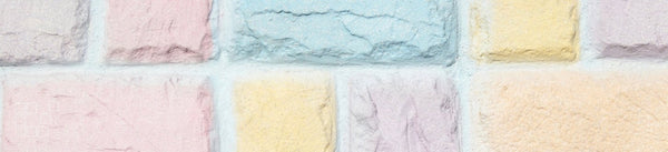 Pastel wall art banner with pale pink blue yellow and mint brickwork