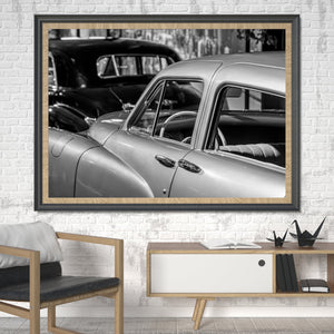 Layered vintage cars in black and white composition
