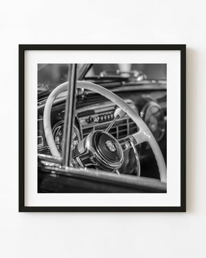 1947 Cadillac white steering wheel and chrome crest in black and white