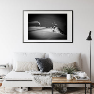 Dramatic clouds and trees enhancing vintage car scene