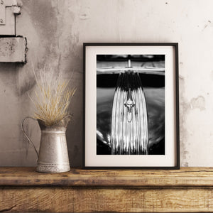 Reflections on the hood of a vintage Lincoln