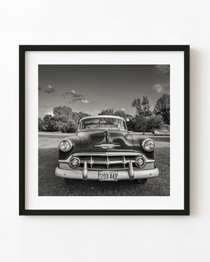 1953 Chevrolet Bel Air viewed head-on along Route 66 in black and white