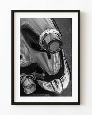 1953 Corvette tail light and curved chrome bumper in black and white