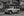 Willys Wagon classique devant une maison historique de style bardeau