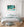 Chrome door handle beneath the turquoise steering wheel and curved gauges