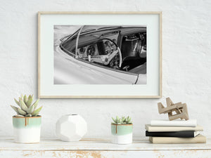 Black and white close up of retro concept car gauges and wheel