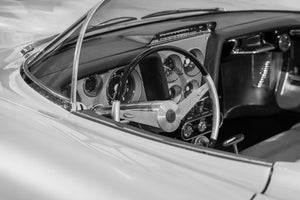 Buick Centurion steering wheel and round gauges behind a curved windshield