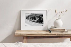 Pale Buick bodywork framing dark instruments and reflective chrome controls