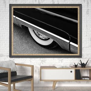 Polished wheel centre beneath the curved rear bodywork of a 1956 Lincoln
