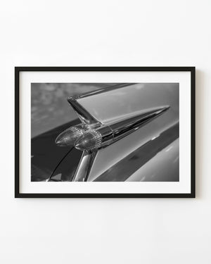 1959 Cadillac tailfin and twin bullet taillights in black and white