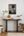 Worn cupboard doors and a small kitchen table in Clarence Town on Long Island, Bahamas.