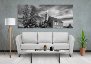 Black and white photograph of a weathered prairie church near Leross.