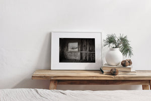 Rustic barn interior with framed view
