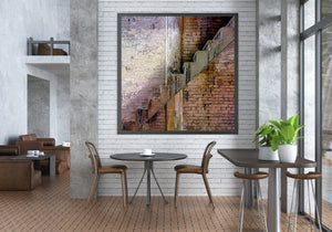 Industrial stairs rise beside a worn vertical column and layered brick textures.