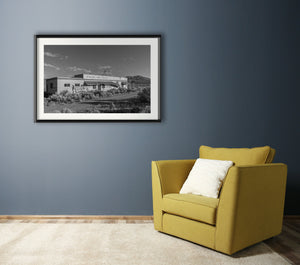 sunlit desert ruin with mountains in background