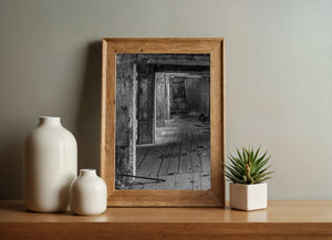 Receding rectangular openings lead into the shadows of an abandoned factory