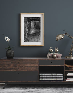 Weathered floorboards and a leaning panel inside a deserted Ontario factory