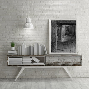 Repeating concrete frames reveal the depth of a ruined industrial building