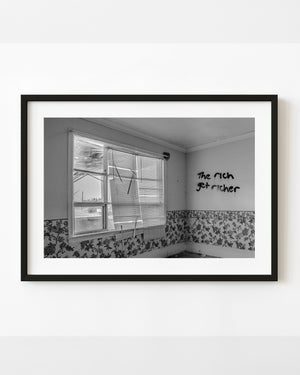 Abandoned Ontario living room with graffiti, broken blinds and floral wallpaper in black and white