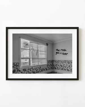 Abandoned Ontario living room with graffiti, broken blinds and floral wallpaper in black and white