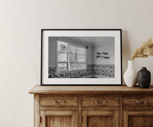Daylight enters an abandoned Ontario room through a window with bent blind slats