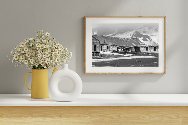 Foggy mountains and decaying building in monochrome