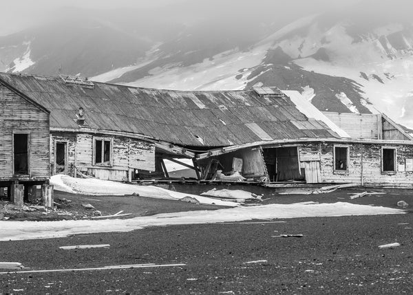 Historic decaying building in snow