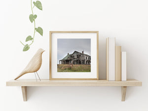 Old farmhouse with broken windows in Indiana countryside