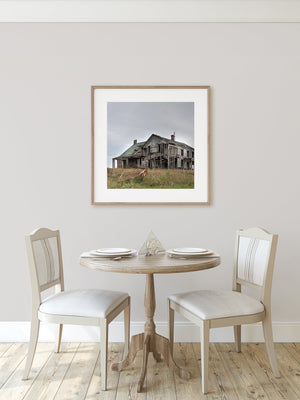 Historic abandoned wooden farmhouse in rural Midwest