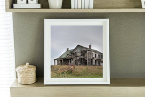 Weathered farmhouse exterior with fading paint in Indiana