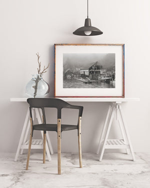 Rustic boathouse reflection in calm water