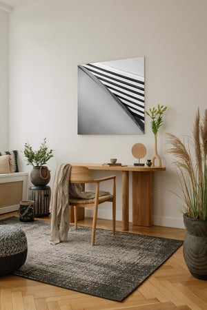 Light and shadow emphasize the repeated louvres of a vintage Cord car hood.