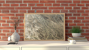 Aerial Alaska photograph with intricate winding channels and continuous beige and brown textures.