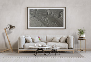 A broad curve links smaller channels across finely textured coastal ground.