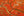 Colour aerial photograph of Alaska coastal marshes with orange vegetation and dark branching channels.