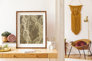 An overhead coastal view reveals winding channels and delicate branching lines.