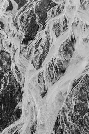 Braided river patterns in monochrome Alaskan shoreline terrain