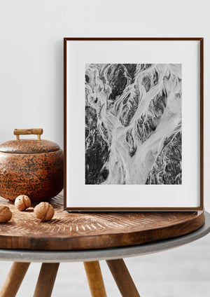 Monochrome landscape with flowing channels and textured earth in Alaska