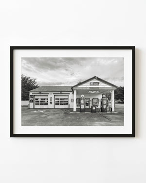 Vintage fuel pumps and service bays at Ambler’s Texaco on Route 66, photographed in black and white.