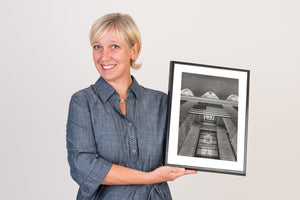 Black and white photo of NYC landmark with American flag