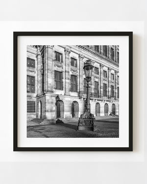 Amsterdam Royal Palace and an ornate streetlamp photographed in black and white.