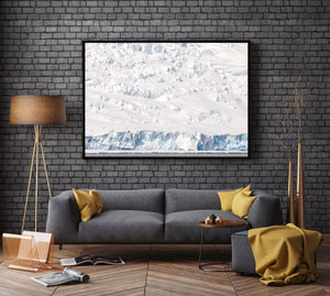 Broken ice face forming a horizontal edge above dark rippled Antarctic water.