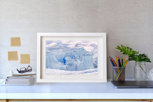 Natural patterns of blue shadow, fractured ice and white snow in Antarctica.