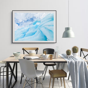 Colour abstract photograph of curved Antarctic ice and a small opening near its top.
